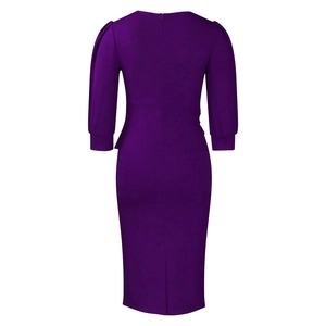 Close-up of dark purple bodycon dress with 3/4 puff sleeves and back slit detail