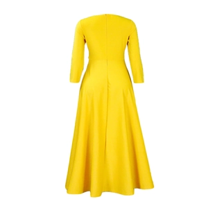Detail view of the yellow dress showing the invisible back zipper and waist cinching