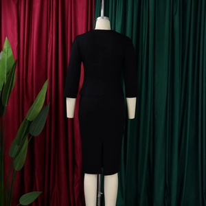 Elegant black two-piece skirt set with ruffle sleeves and a stylish back slit detail