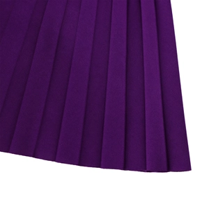Detailed macro view showing professional pleated fabric and texture of the purple dress