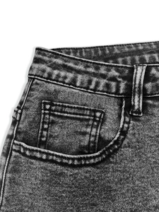 Detail of high waist dark gray washed denim with reinforced stitching and pocket texture