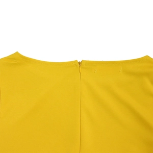 Detail of round neckline with invisible zipper on a yellow African maxi dress