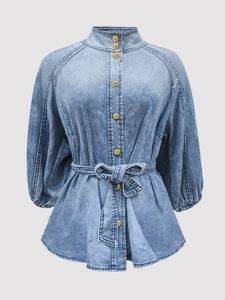 Retro light wash denim shirt with lantern sleeves, stand collar and belted waist detail