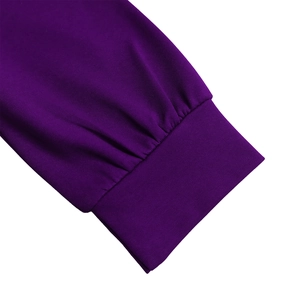 Detail of purple dress featuring ribbed cuffs and pleated sleeve texture for women