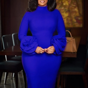 Detailed view of royal blue dress featuring 3D floral sleeve and high neck design