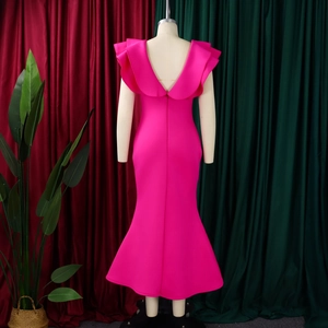 Detail of elegant fuchsia mermaid dress featuring tiered ruffles and slim fishtail hem