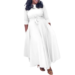 Detail of white round neck dress showing the waist tie and large flowing hemline