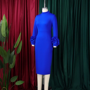 Detailed view of the royal blue dress with 3D floral ruffles on the long sleeves