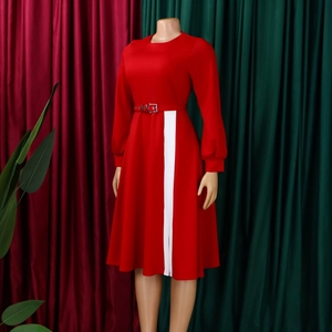 Detail of red long sleeve dress featuring white vertical stripes and a matching belt