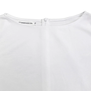 Close-up of white dress neckline with hidden zipper and texture details