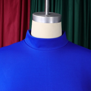 Detail of royal blue high neck long sleeve dress with elegant textured knit fabric