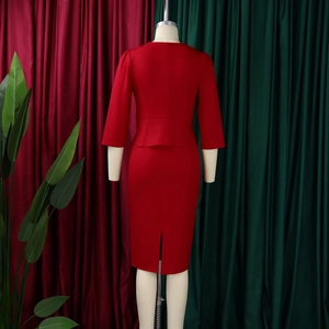 Detail view of the back split design and peplum waist on this burgundy formal dress