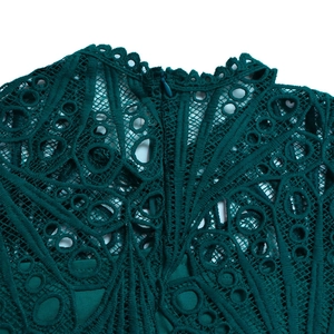 Close-up of dark green hollow lace hollow floral design and invisible zipper detail