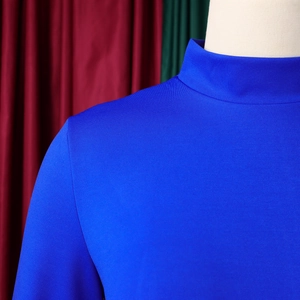 Detailed close-up of dark blue mock neck dress featuring high-density knit mesh texture