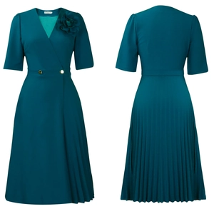 Detail view of V-neck pleated dress with 3D flower accent and gold buttons in dark teal