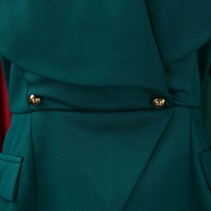 Detail of elegant dark green blazer dress with cross waist design and gold spherical buttons