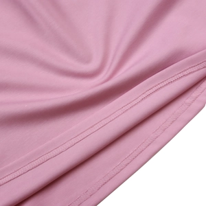 Detail of pink knit fabric with fine texture and high-quality double-needle stitching seam