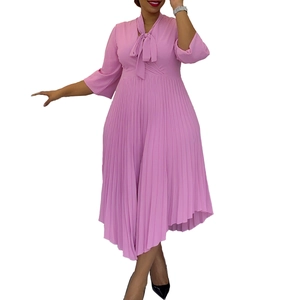 Detail of elegant pink dress with bow neckline and pleated irregular chiffon skirt
