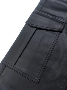 Close-up of black cargo pants with flap pocket and durable double stitching detail