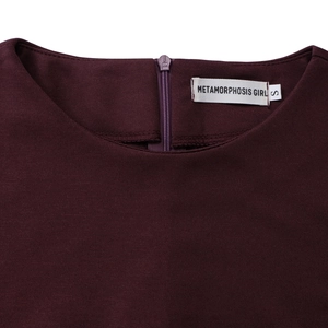 Detail of burgundy high waist dress featuring a discreet back zipper and crew neckline