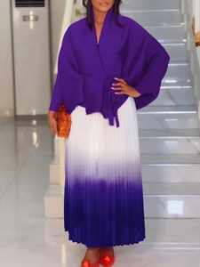 Completo africano taglie forti con top a portafoglio viola e gonna a pieghe sfumata