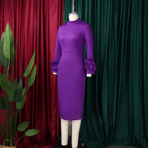 Detail of purple mock neck dress showing elegant 3D floral accents on the long sleeves