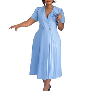 Detail of sky blue V-neck dress featuring a 3D floral applique and pleated skirt side
