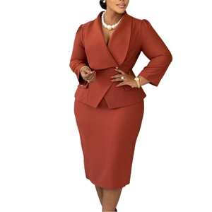 Detail view of rust red business suit with shawl collar blazer and pencil skirt