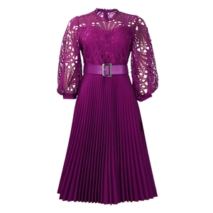 Detail of dark burgundy lace hollow sleeves and pleated hem with matching waist belt