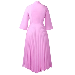 Detail view of pink pleated mid-length dress with elegant stand collar and 3/4 sleeves