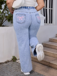 Plus size light blue straight leg jeans with pink bow embroidery detail on back pocket