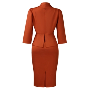 Detail view of the rust-colored peplum top with back slit pencil skirt suit set
