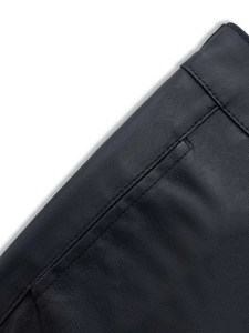 Detailed close-up showing high-density twill fabric and double stitching on black cargo pants