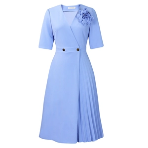 Detail of light blue V-neck dress featuring a handmade 3D flower and pleated skirt panel