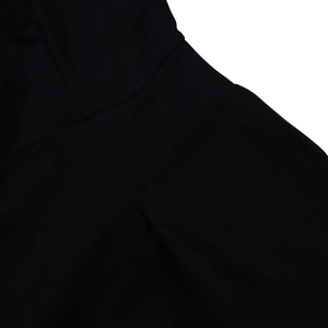 Close-up of the elegant black fabric texture and smooth seams on a V-neck dress