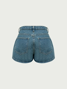 Back view of blue denim skort with two rear pockets and minimalist A-line cut design