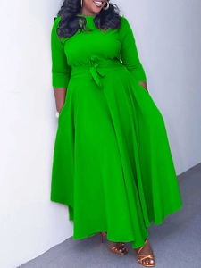 Elegant bright green long sleeve maxi dress with waist tie and wide flared skirt