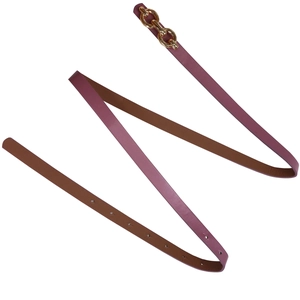 Close-up of slim dark pink leather belt featuring a gold metal chain buckle