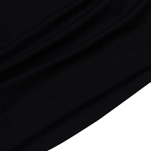 Macro shot of black fabric texture with high-quality double needle stitching on the hemline