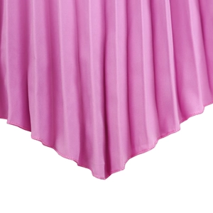 Detail of pink pleated fabric with micro accordion folds and asymmetrical hemline design