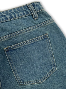 Women's mid-blue denim skort with A-line cut, back pockets and classic yellow stitching