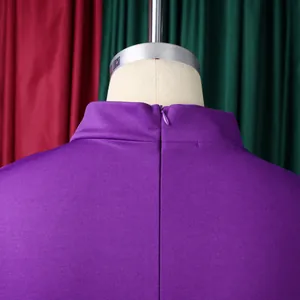 Detail view of the purple knit dress featuring a high collar and invisible back zipper