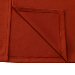 Detailed close-up showing the premium double-needle stitching on the brick red knit dress