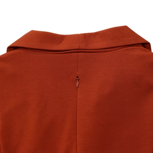 Close-up of the back neckline with hidden zipper on this elegant orange bodycon dress