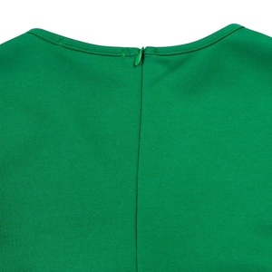 Detailed close-up of the green V-neck dress featuring a seamless invisible back zipper
