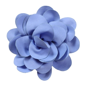 Detailed macro view of the royal blue pleated fabric flower with layered petals