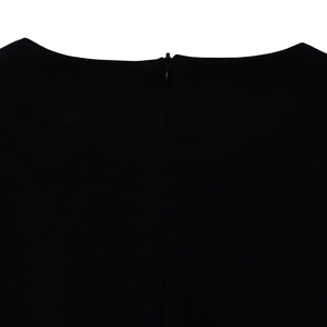 Detail view of the round neckline featuring a concealed black zipper on this elegant dress