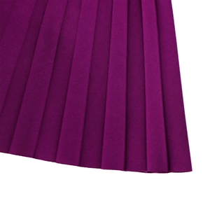 Detail shot of deep purple pleated fabric with sharp vertical accordion folds