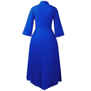 Detail of royal blue midi dress featuring high neck, wide sleeves and pleated skirt back