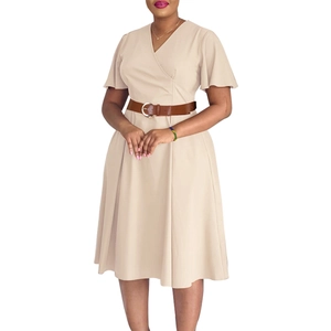 Detail of elegant V-neck beige dress with ruffle sleeves and brown leather belt